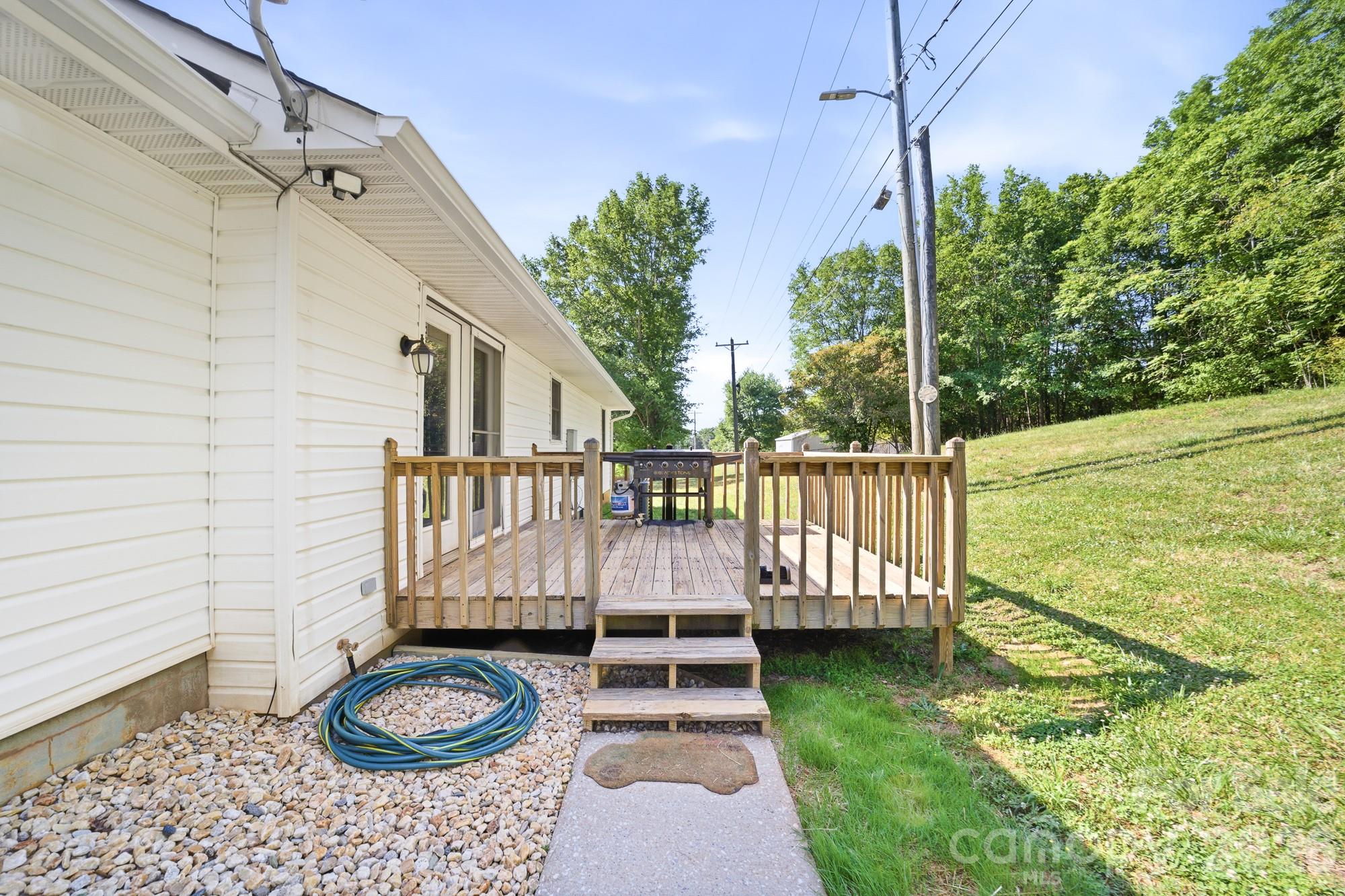 248 Jack McKinney Road Forest City, NC 28043 - Photo 7 of 29 a view of a deck with wooden floor and a chair