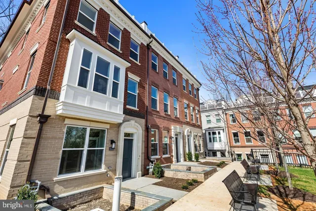 a front view of a house with glass windows