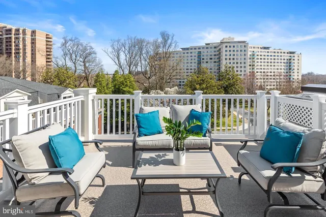 a view of a patio with couple of chairs