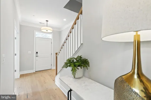 a living room with furniture and a painting on the wall