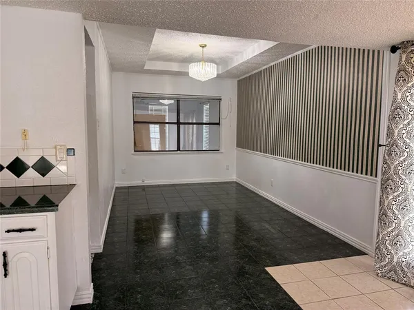 a view of a livingroom with wooden floor