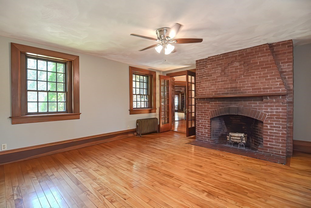 1 Summit Road Franklin, MA 02038 - Photo 21 of 42 a view of a livingroom with a fireplace and window