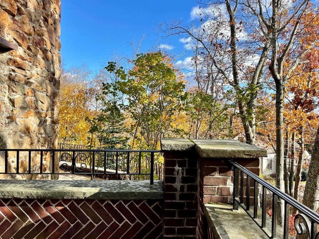 1 Summit Road Franklin, MA 02038 - Photo 4 of 42 a view of a balcony with two chairs and a table