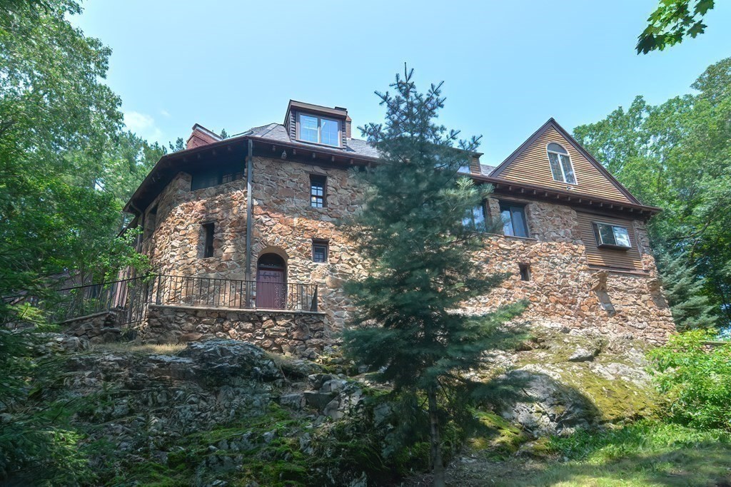 1 Summit Road Franklin, MA 02038 - Photo 7 of 42 a front view of house with yard and trees in the background