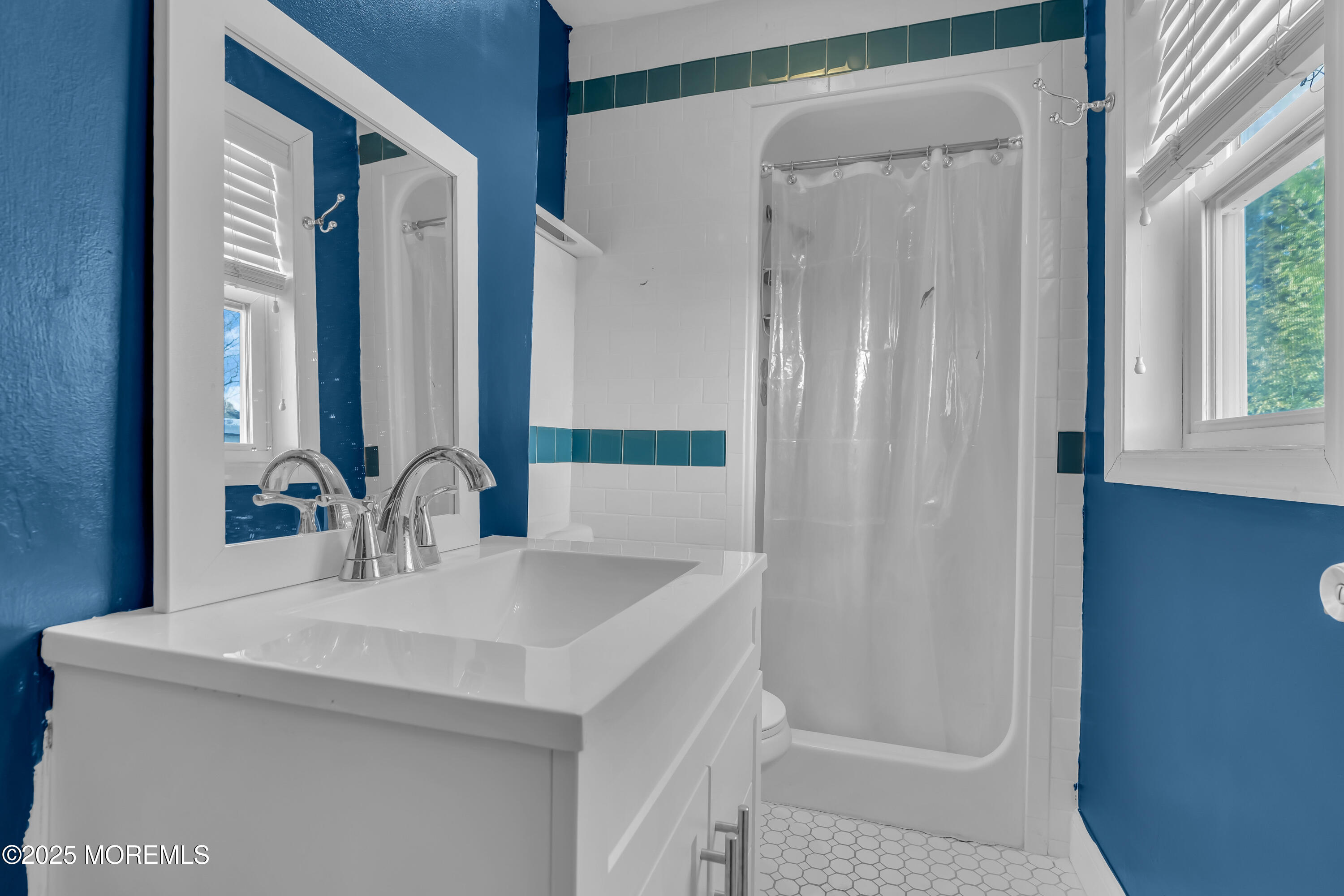 104 Garden Road Shrewsbury, NJ 07702 - Photo 16 of 24 a bathroom with a sink and a mirror