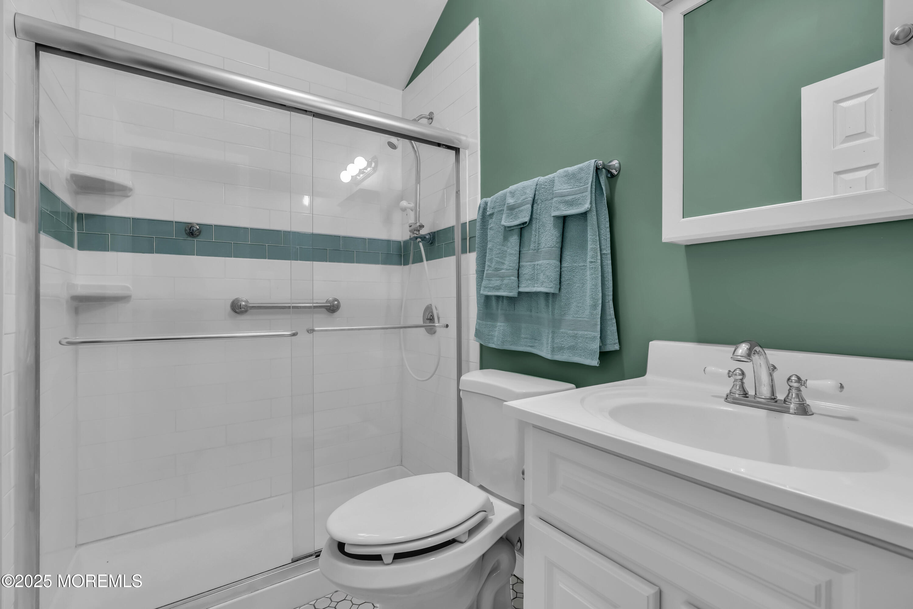 104 Garden Road Shrewsbury, NJ 07702 - Photo 19 of 24 a bathroom with a sink a toilet and shower