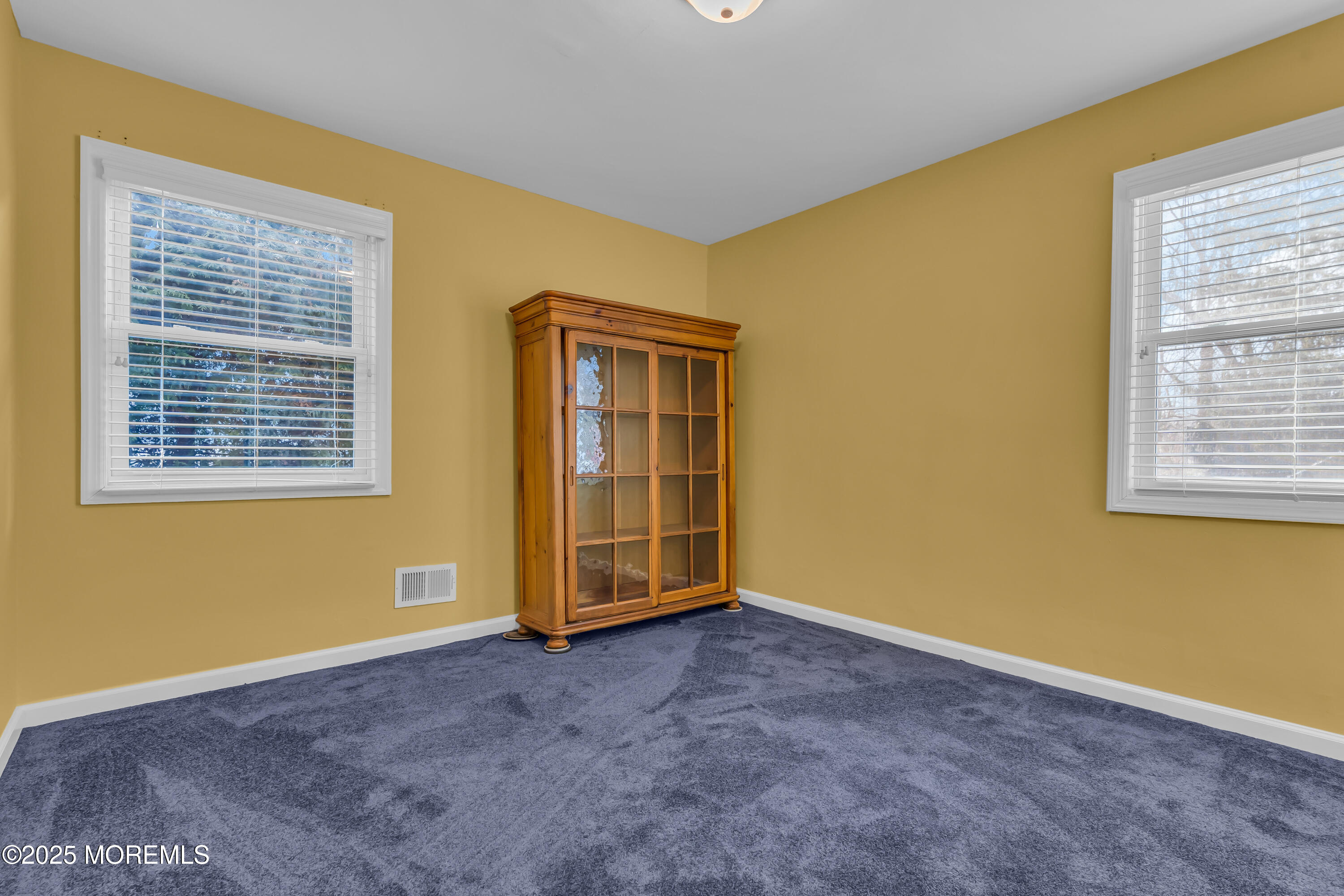 104 Garden Road Shrewsbury, NJ 07702 - Photo 21 of 24 a view of an empty room with a window