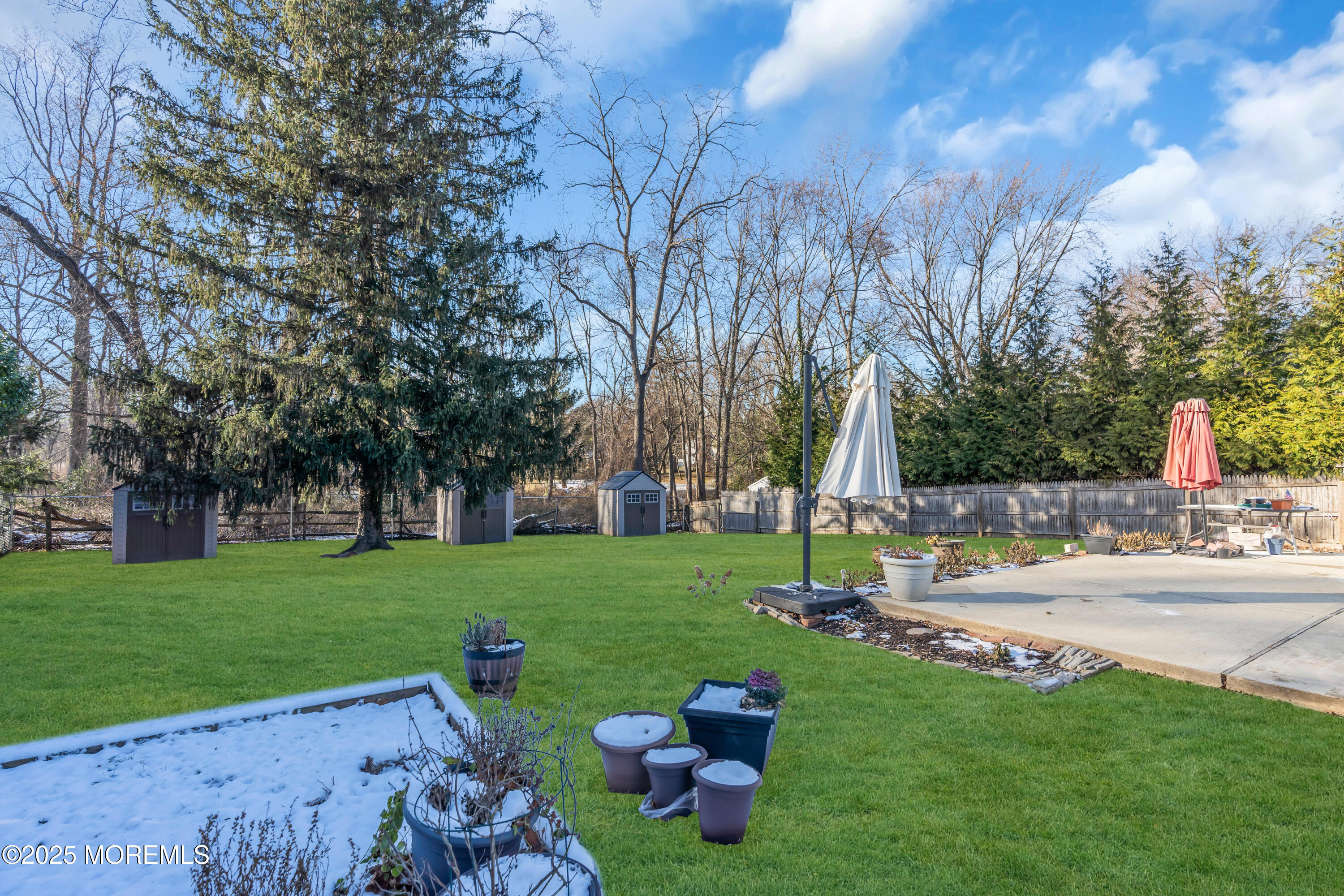 104 Garden Road Shrewsbury, NJ 07702 - Photo 22 of 24 a view of a garden with plants and trees