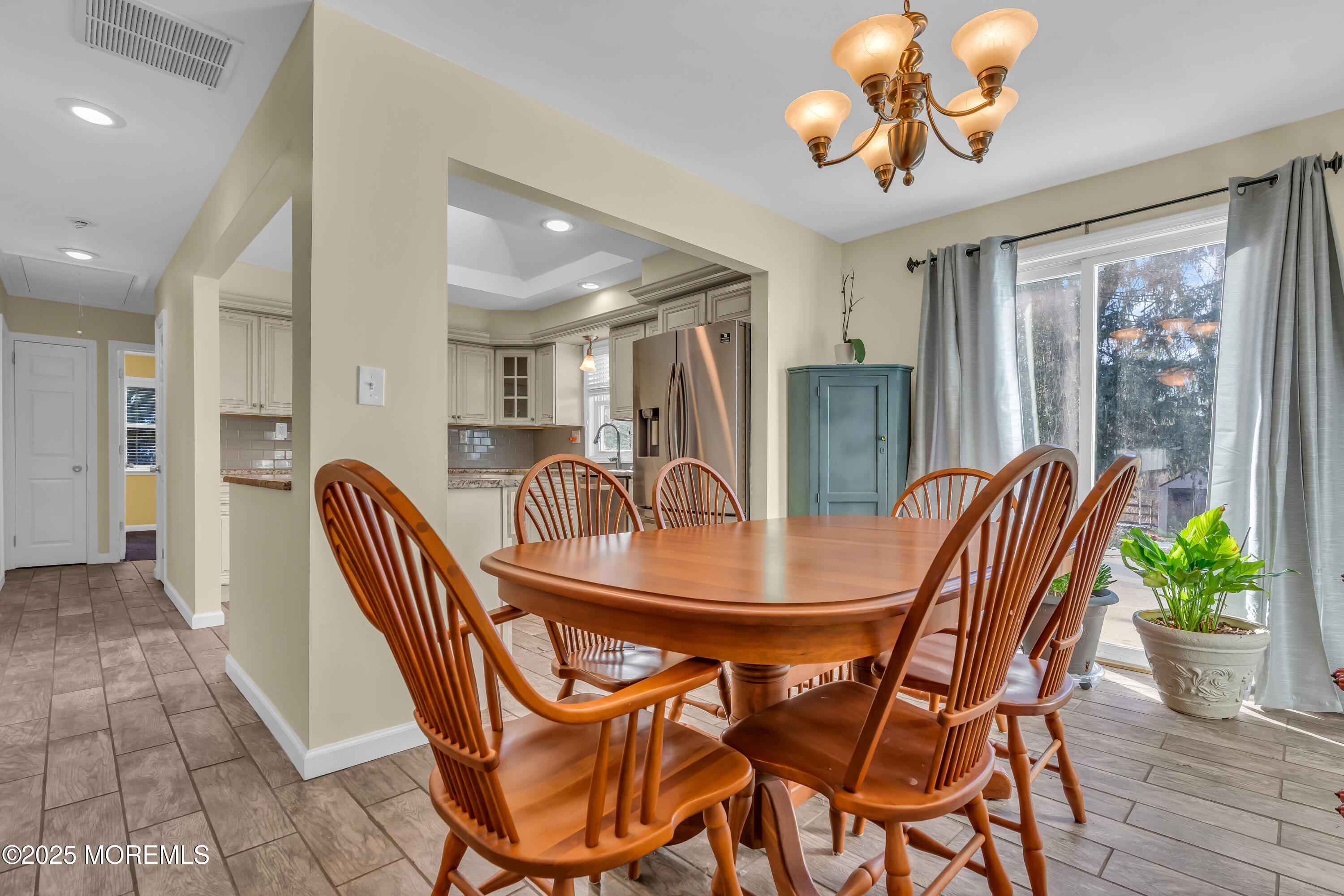 104 Garden Road Shrewsbury, NJ 07702 - Photo 10 of 24 a view of a dining room with furniture wooden floor and chandelier