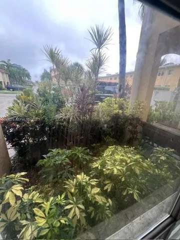 a front view of a house with yard