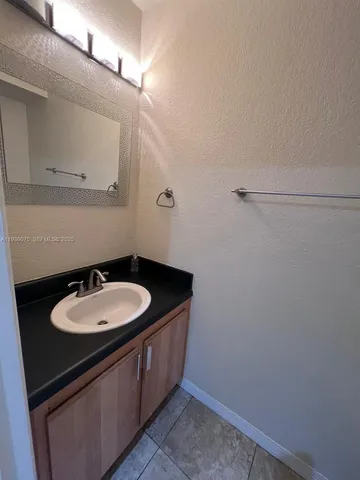 a white toilet sitting next to a shower