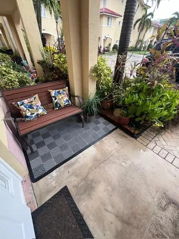 a view of a hallway to rooms and dining room