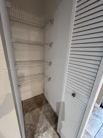 a room with furniture and window