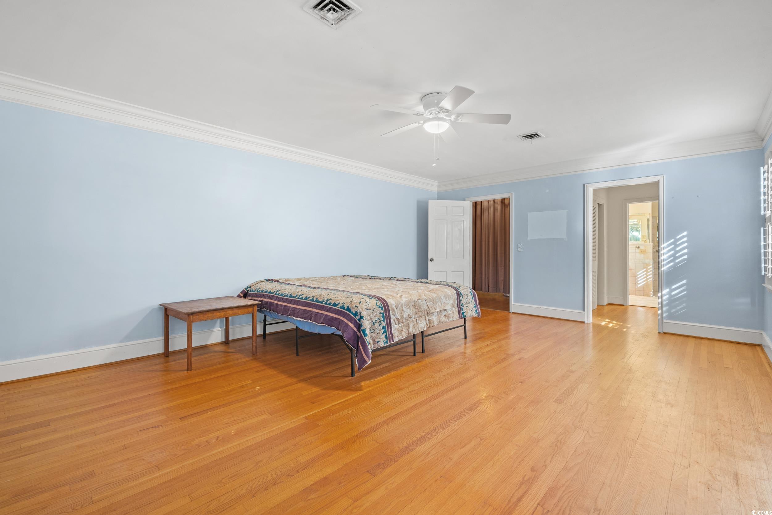 607 North Main Street Nichols, SC 29581 - Photo 15 of 39 Bedroom featuring ornamental molding, light wood-style floors, and a ceiling fan