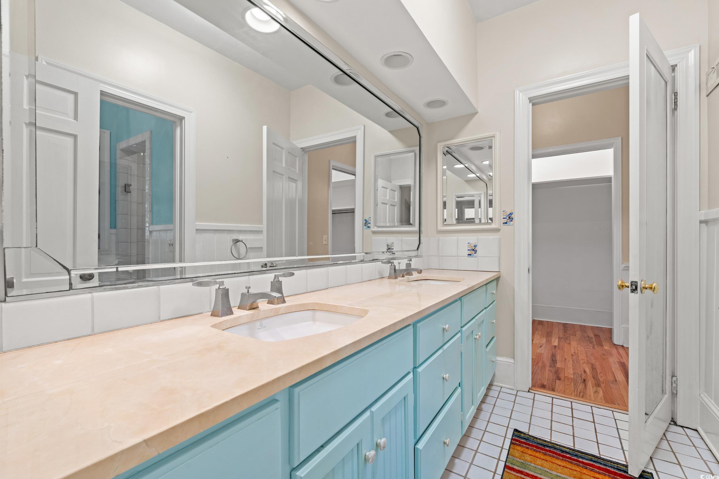 607 North Main Street Nichols, SC 29581 - Photo 22 of 39 Bathroom with light tile patterned flooring, double vanity, and a shower