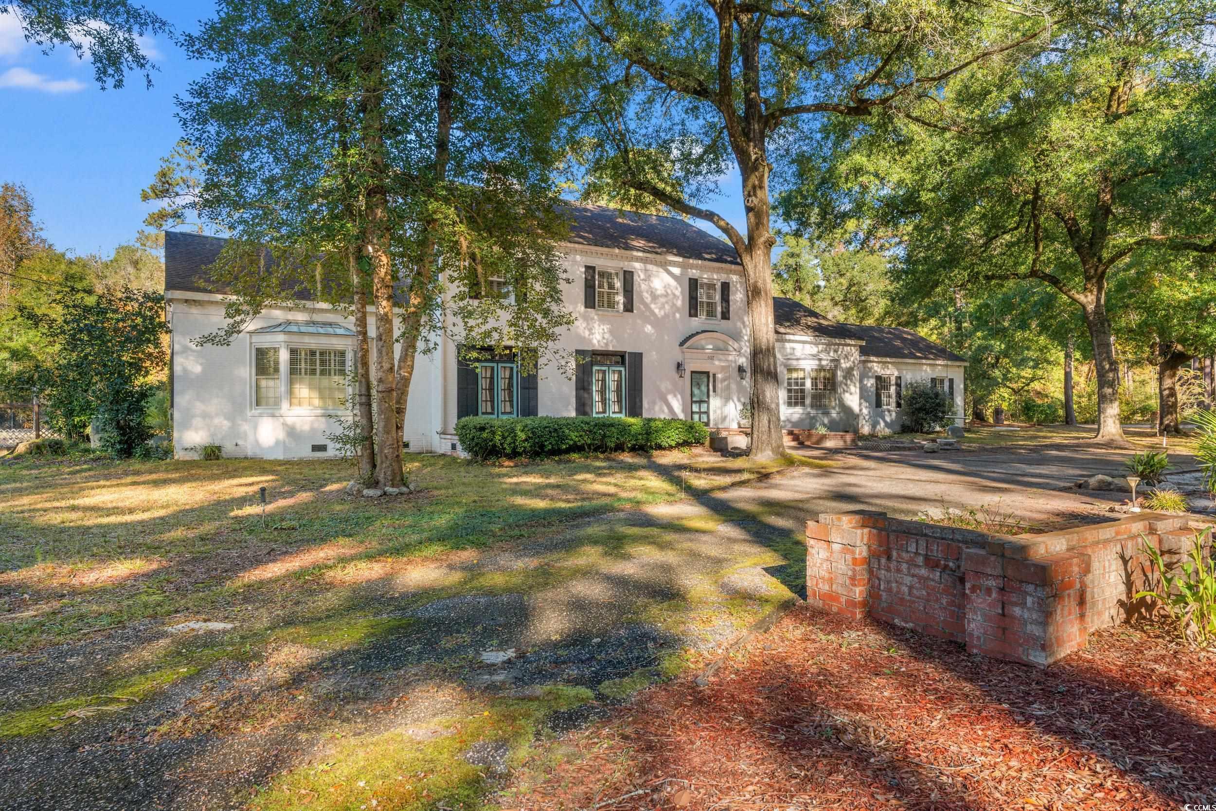 607 North Main Street Nichols, SC 29581 - Photo 38 of 39 View of front of home featuring stucco siding and a front yard