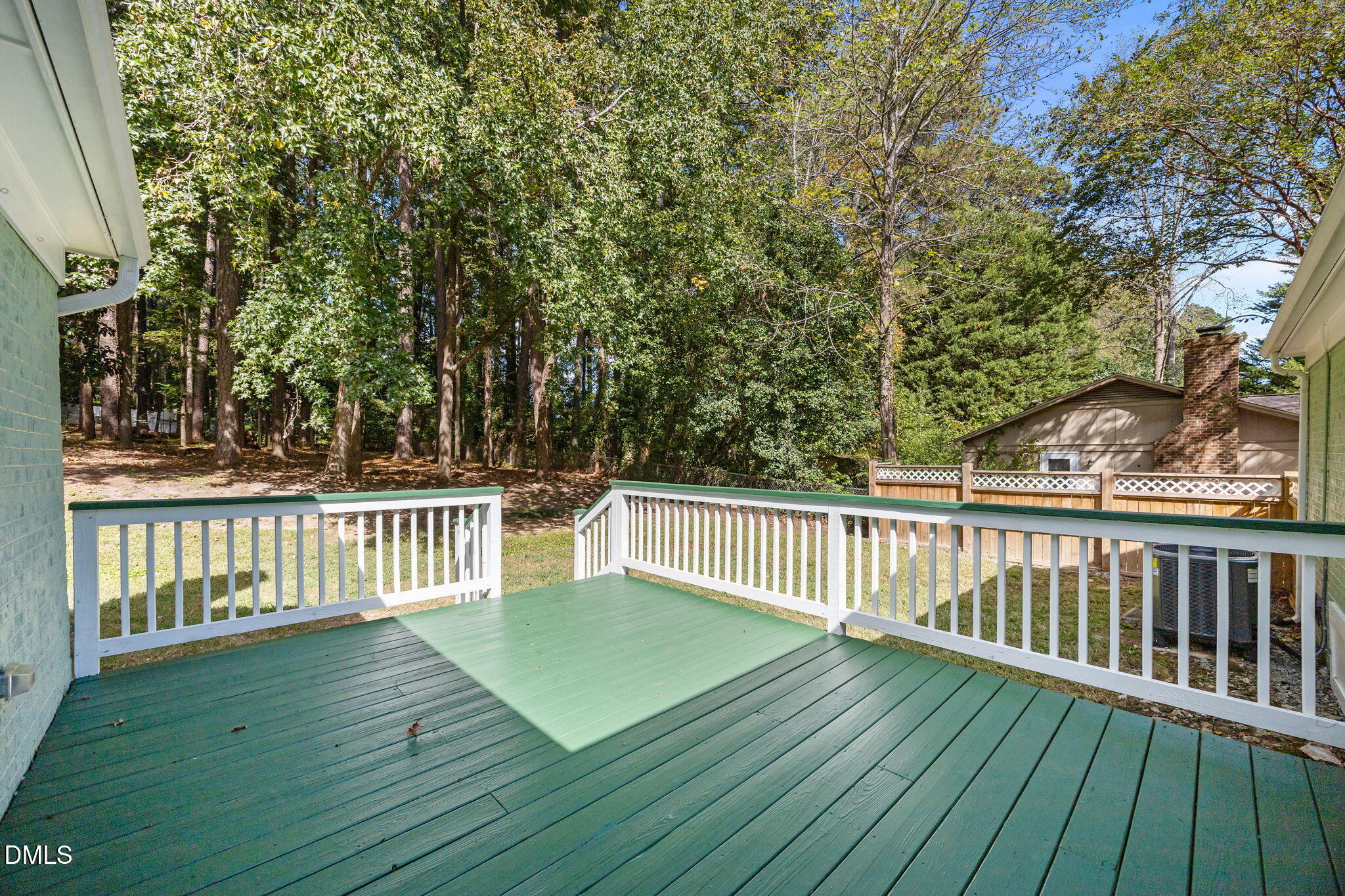 704 Brighton Road Durham, NC 27707 - Photo 11 of 23 a view of deck with wooden floor and fence