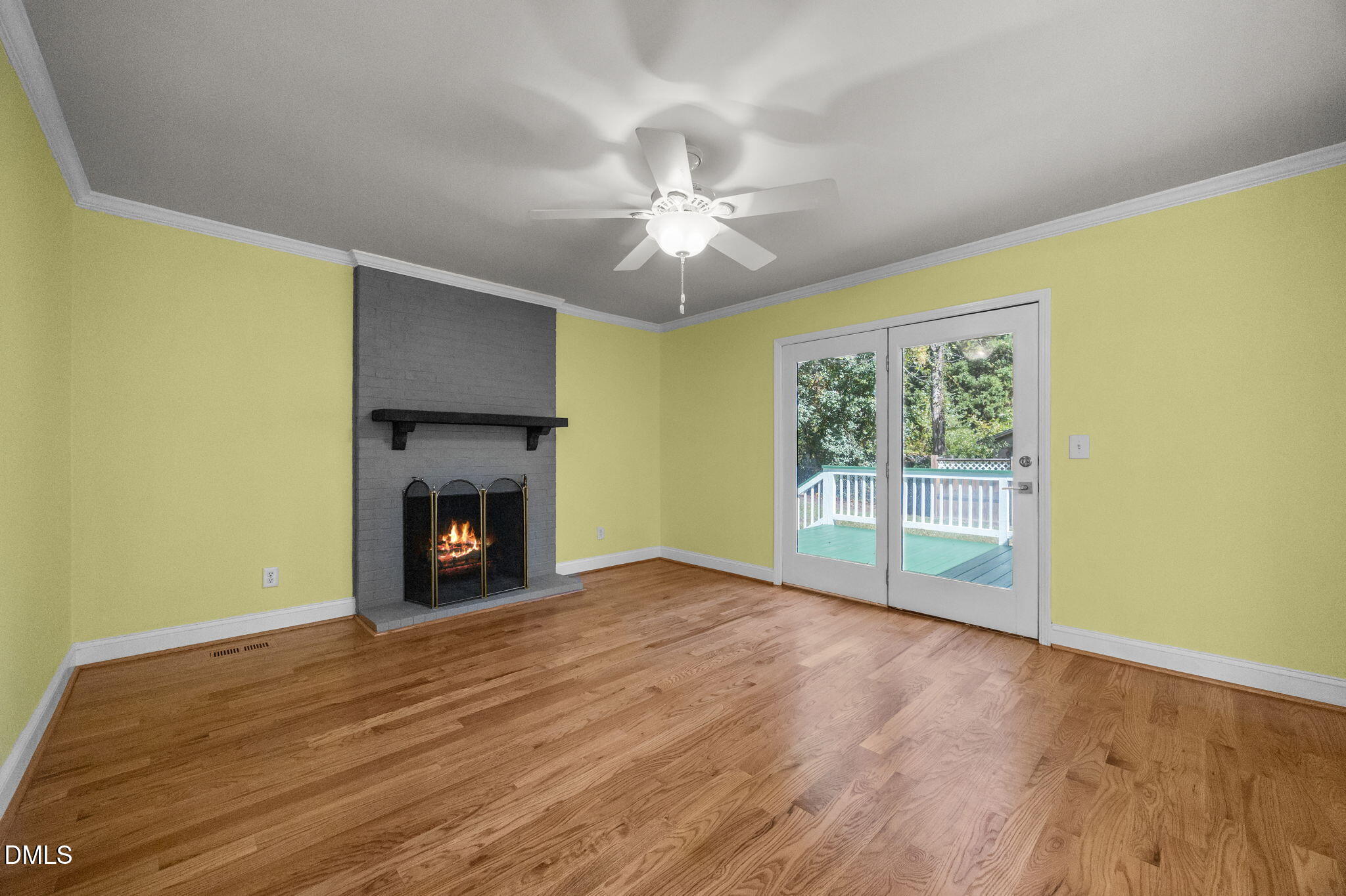 704 Brighton Road Durham, NC 27707 - Photo 12 of 25 an empty room with windows and fireplace