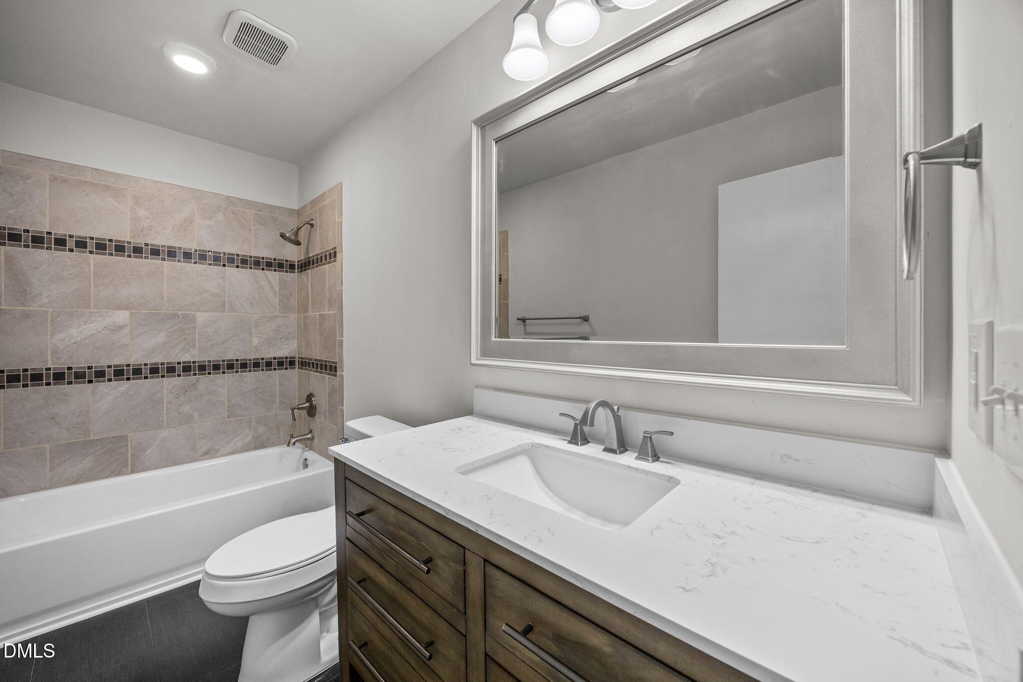 704 Brighton Road Durham, NC 27707 - Photo 17 of 25 a bathroom with a sink a toilet and a bathtub