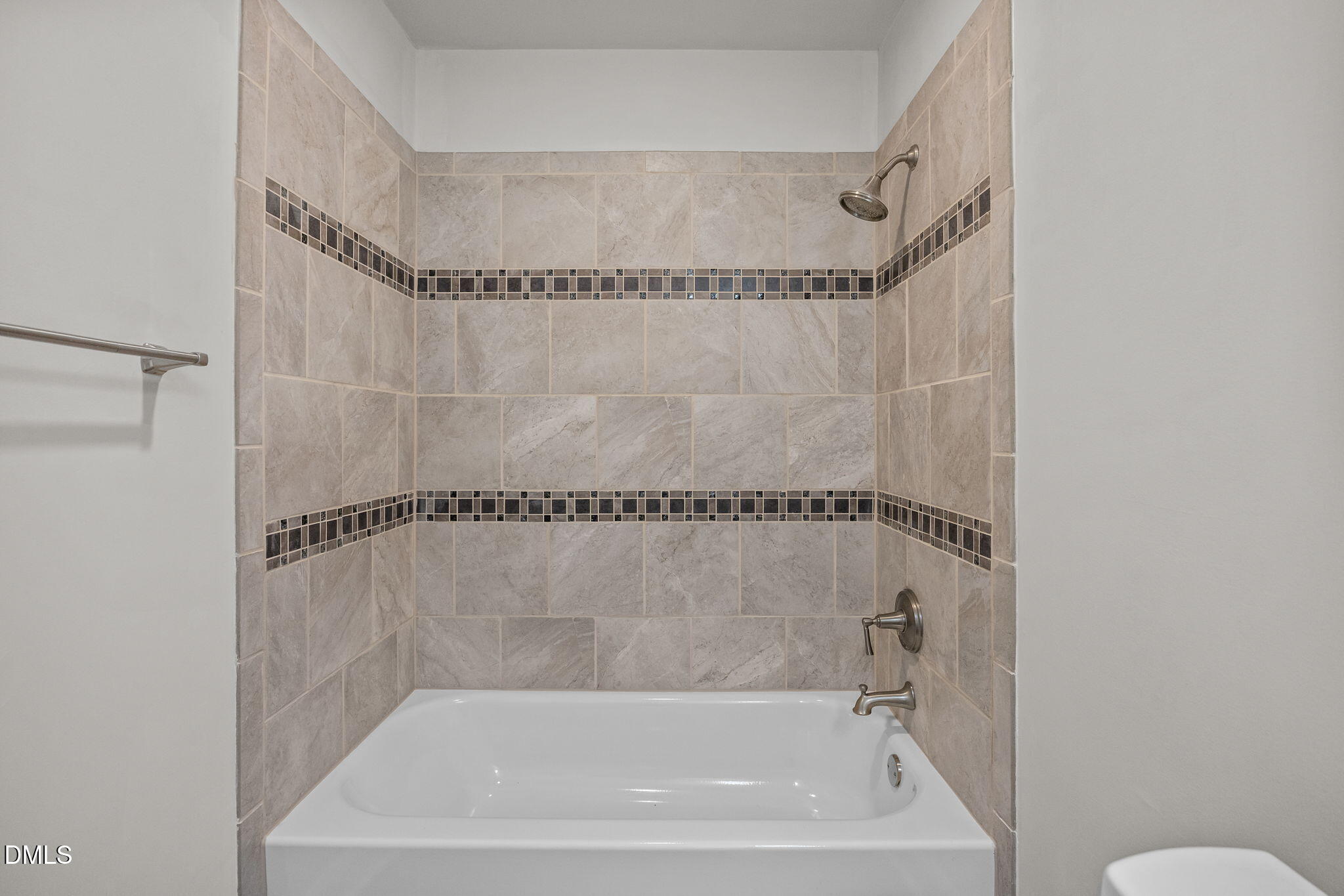 704 Brighton Road Durham, NC 27707 - Photo 19 of 25 a bathroom with a shower and a bath tub