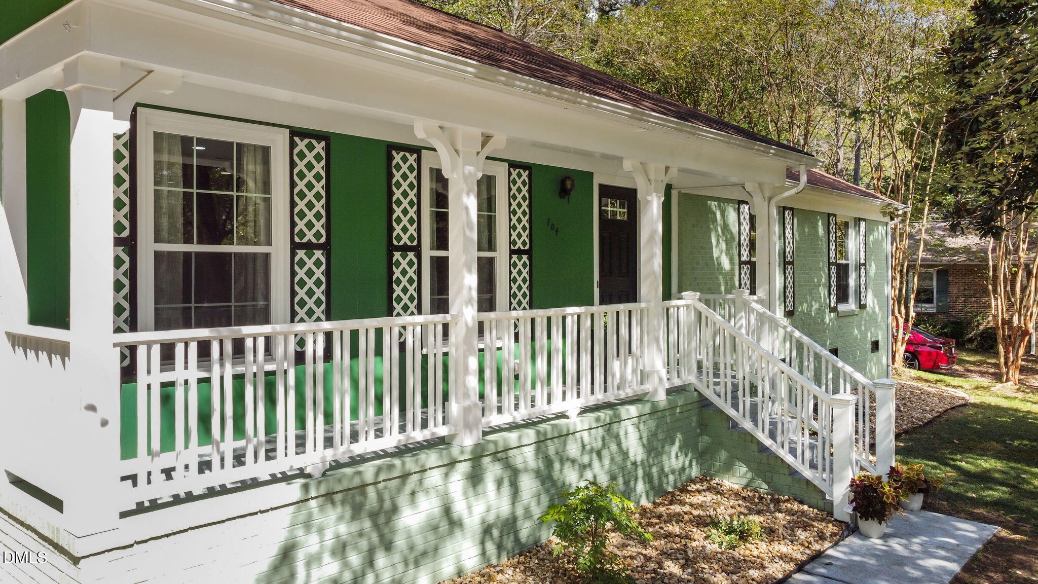 704 Brighton Road Durham, NC 27707 - Photo 2 of 25 a view of a balcony with potted plants and floor to ceiling window