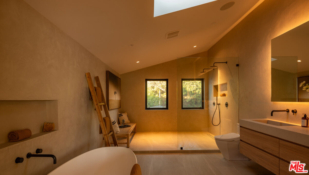 31376 Broad Beach Road Malibu, CA 90265 - Photo 23 of 32 a bathroom with a tub sink and mirror