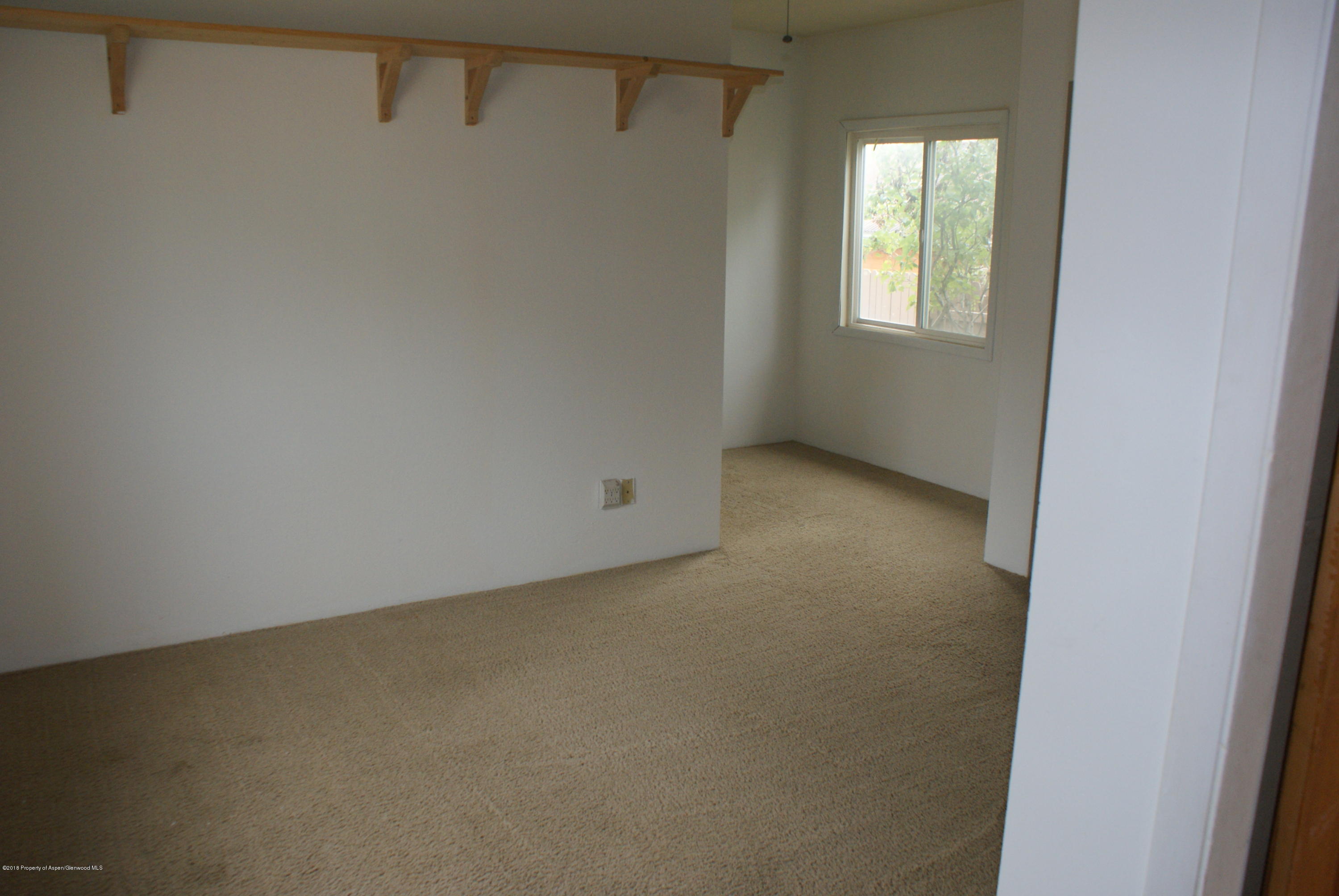 322 Elm Avenue Rifle, CO 81650 - Photo 6 of 13 an empty room with windows