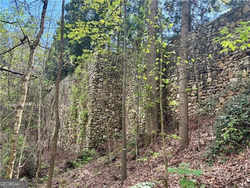 2100 West Wesley Road Northwest Atlanta, GA 30327 - Photo 8 of 42 Millions spent on these walls, providing backdrop for additional structures or sports courts on you 15+ acres.