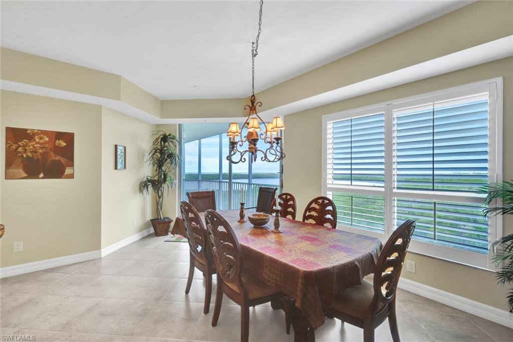 295 Grande Way, Unit 405 Naples, FL 34110 - Photo 11 of 40 a dining room with furniture and window