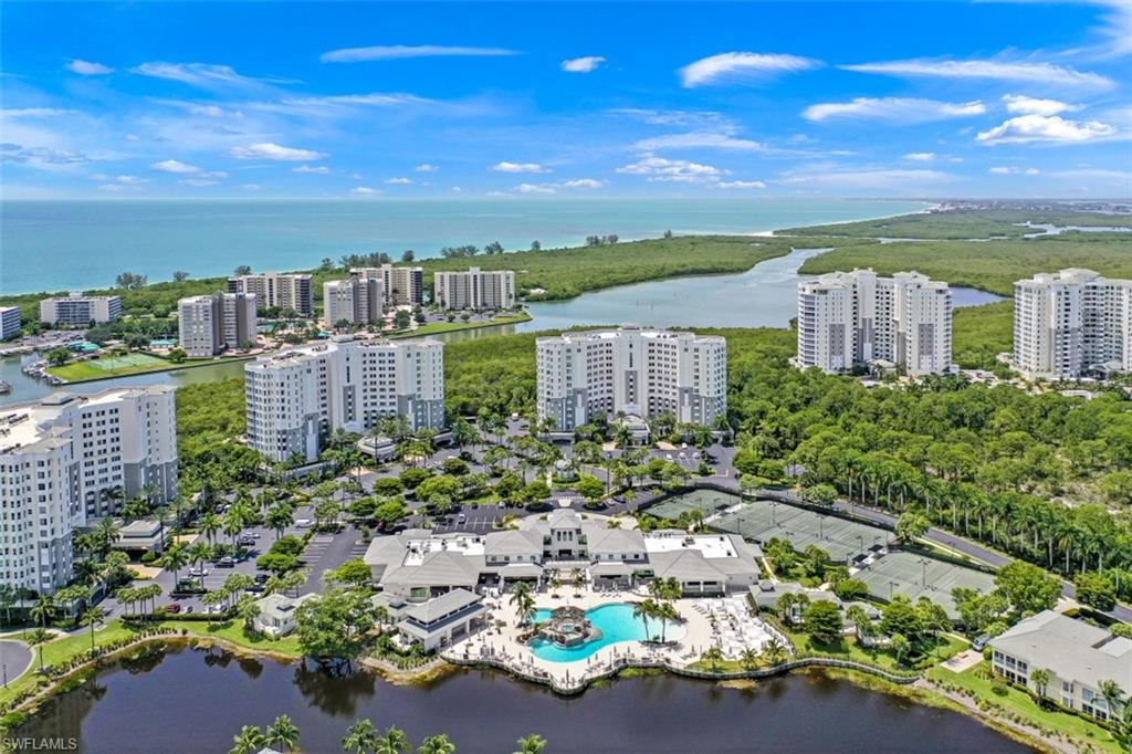 295 Grande Way, Unit 405 Naples, FL 34110 - Photo 2 of 40 a view of a city with tall buildings