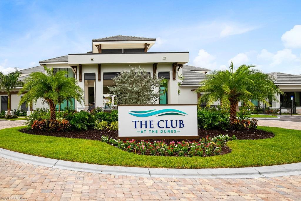 295 Grande Way, Unit 405 Naples, FL 34110 - Photo 25 of 40 a sign on the side of a building