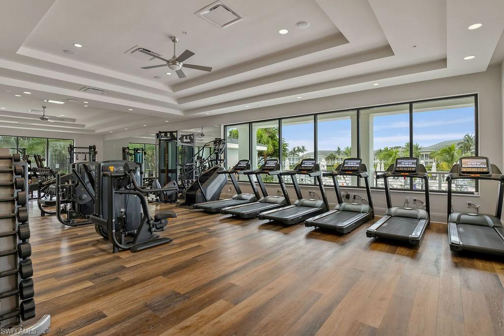 295 Grande Way, Unit 405 Naples, FL 34110 - Photo 32 of 40 a view of a room with gym equipment