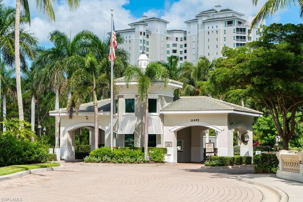 295 Grande Way, Unit 405 Naples, FL 34110 - Photo 34 of 40 a front view of a building with garden