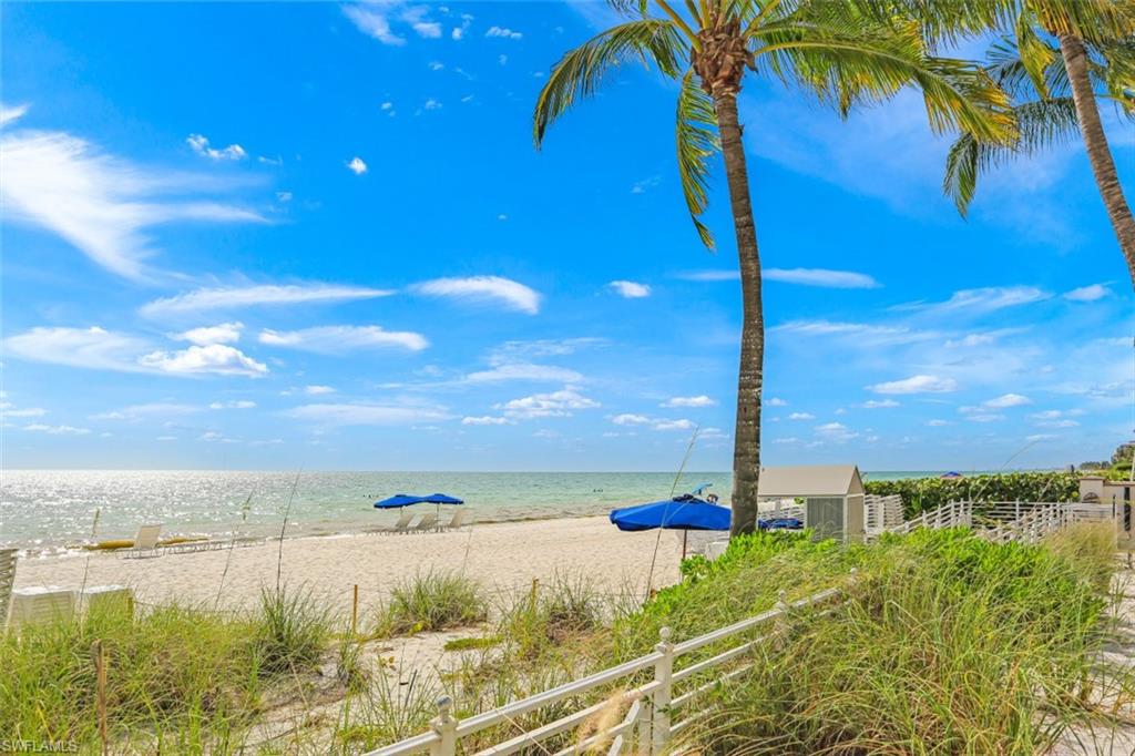 295 Grande Way, Unit 405 Naples, FL 34110 - Photo 40 of 40 a view of a lake and a yard