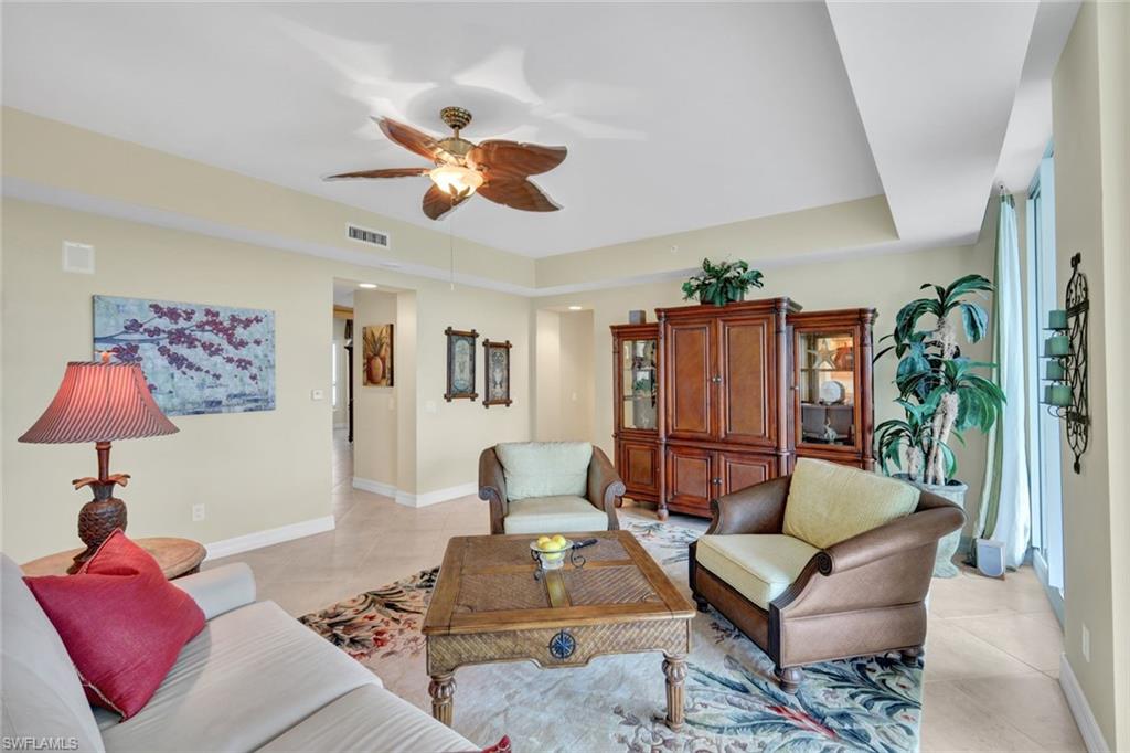 295 Grande Way, Unit 405 Naples, FL 34110 - Photo 6 of 40 a living room with furniture