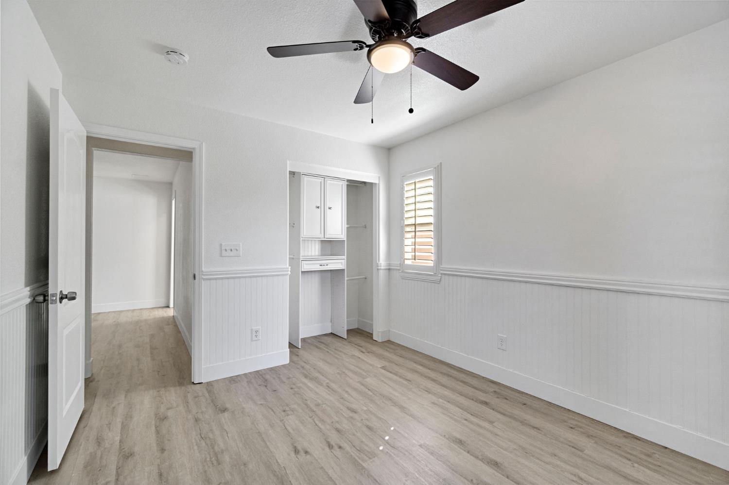 692 Blueberry Lane Madera, CA 93638 - Photo 28 of 44 wooden floor in an empty room with a window