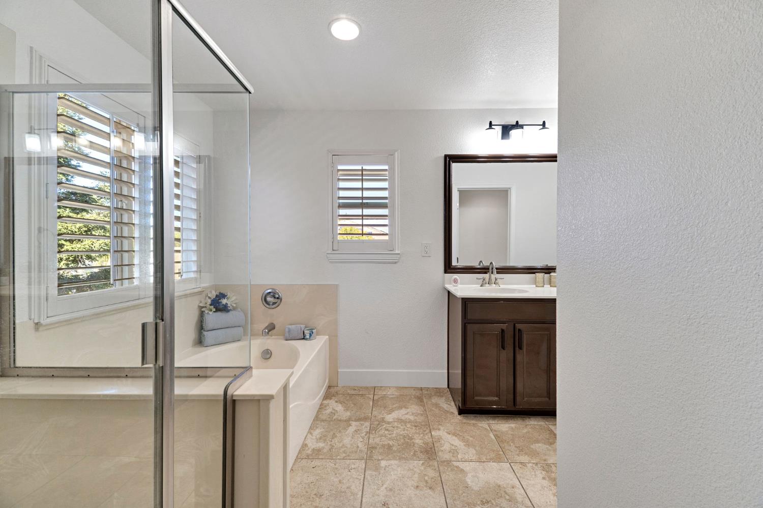 692 Blueberry Lane Madera, CA 93638 - Photo 31 of 44 a bathroom with a sink and a mirror