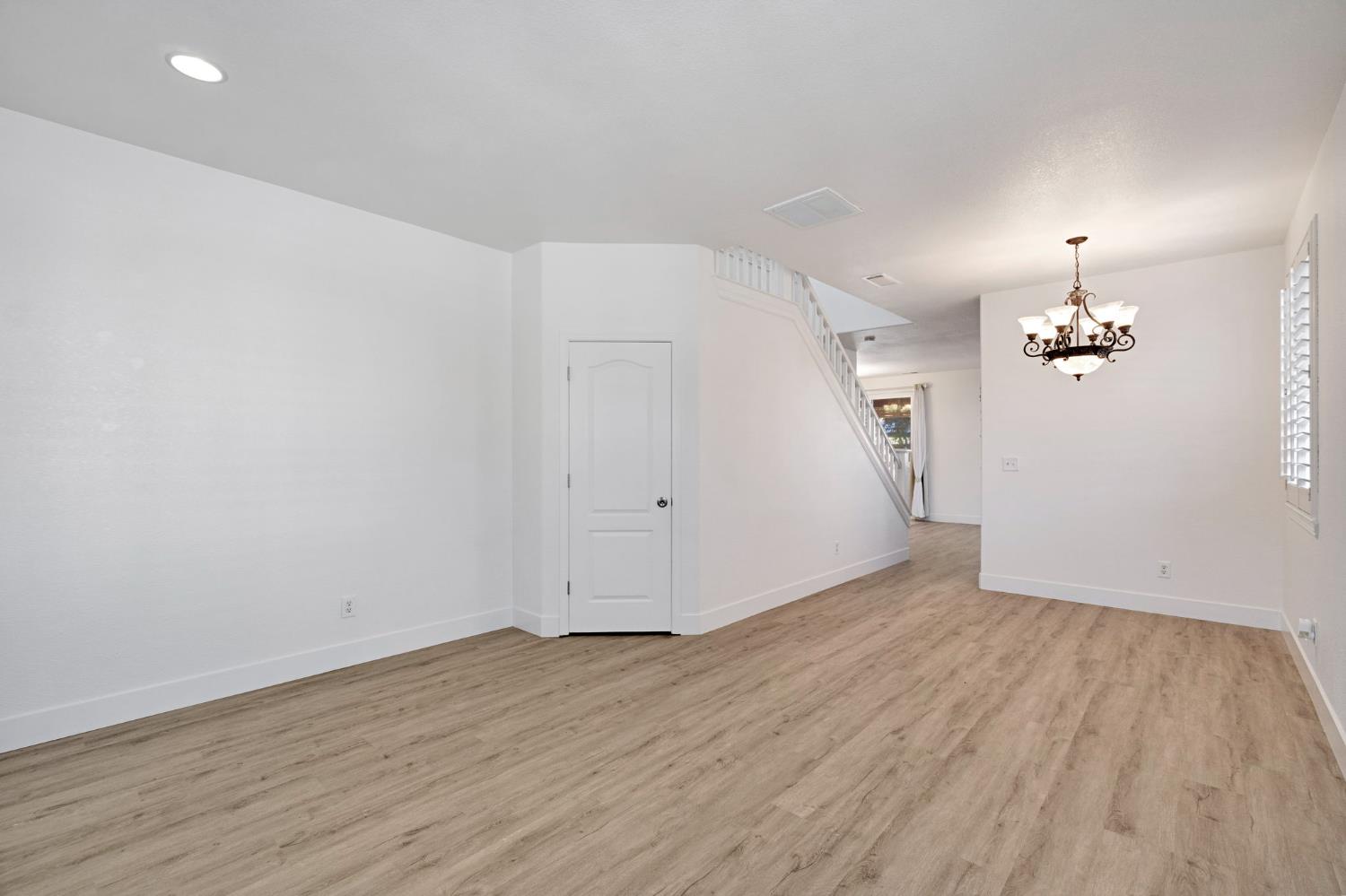 692 Blueberry Lane Madera, CA 93638 - Photo 4 of 44 wooden floor in an empty room with a window