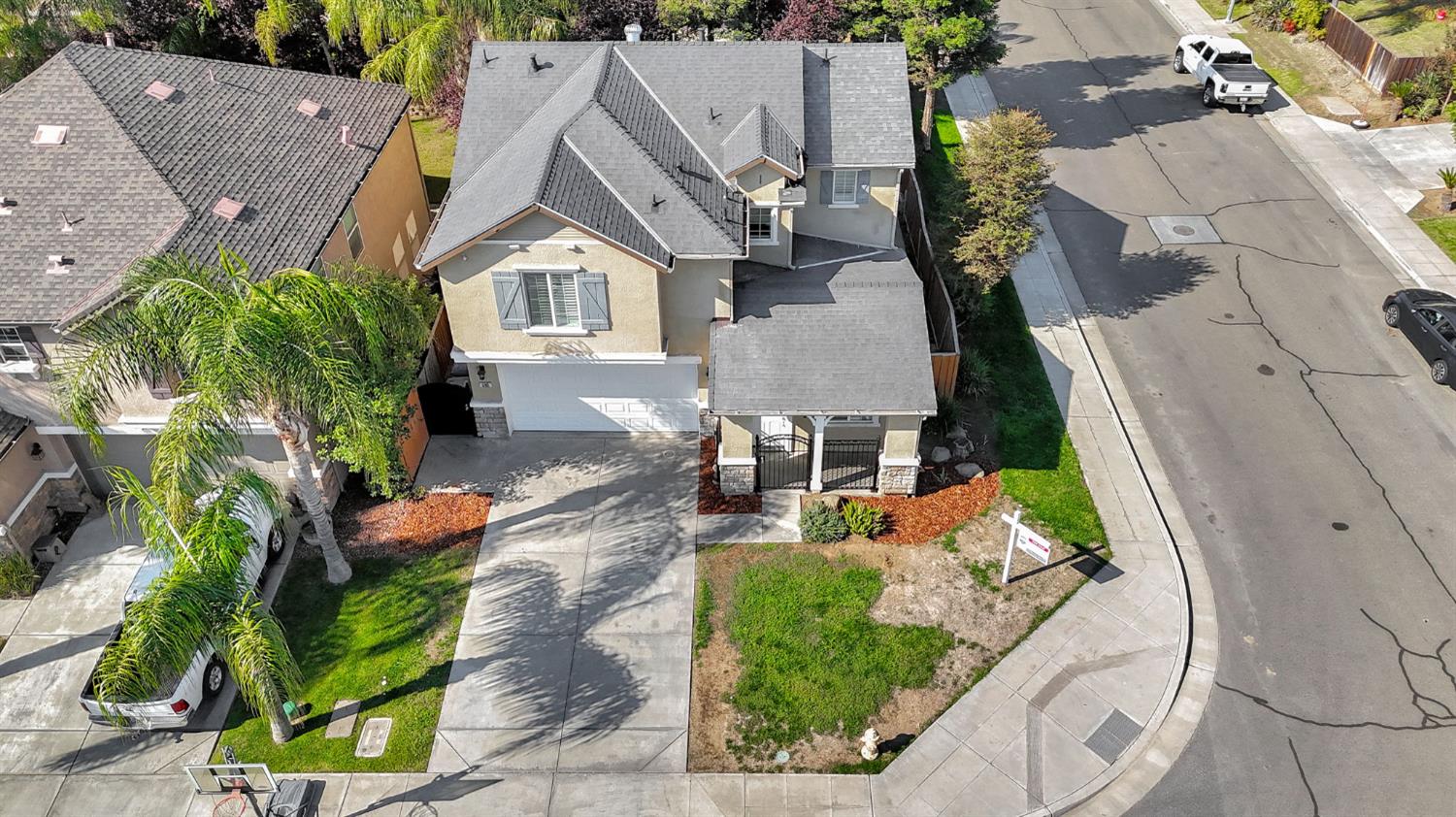 692 Blueberry Lane Madera, CA 93638 - Photo 41 of 44 an aerial view of a house with garden space and street view