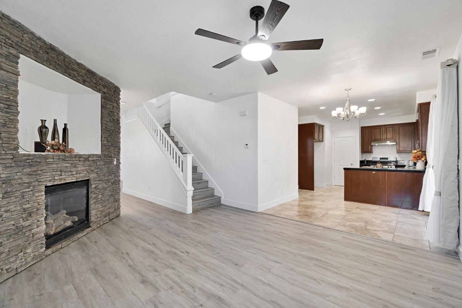 692 Blueberry Lane Madera, CA 93638 - Photo 8 of 44 a view of kitchen and hall with wooden floor