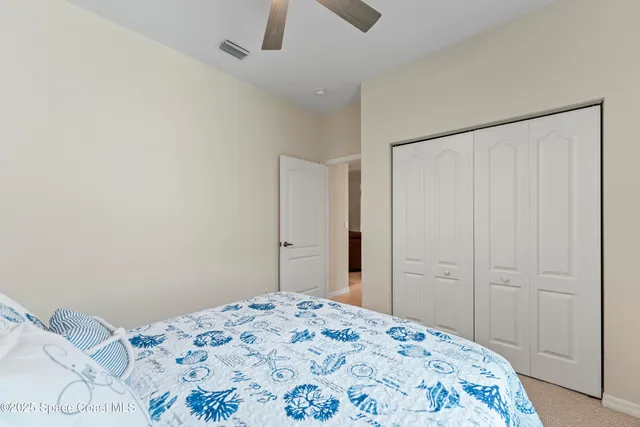 a bathroom with a granite countertop sink mirror toilet and bathtub