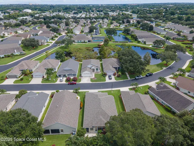 a living room with lots of furniture and a large window