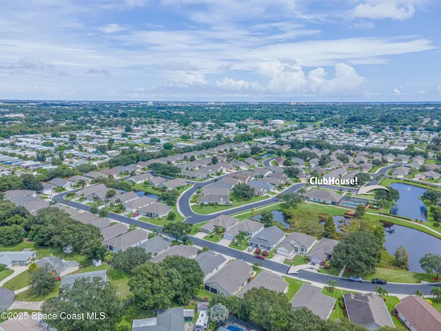a view of a backyard with sitting area
