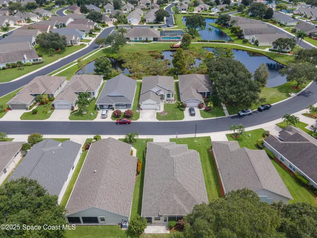 a view of house with swimming pool