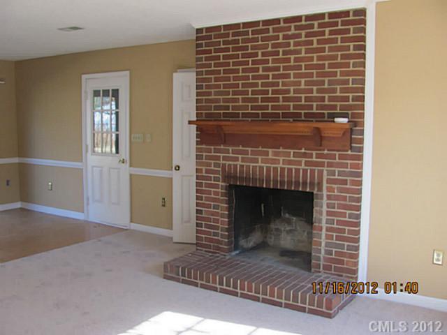 4400 Truscott Road Charlotte, NC 28226 - Photo 2 of 15 a living room with a fireplace