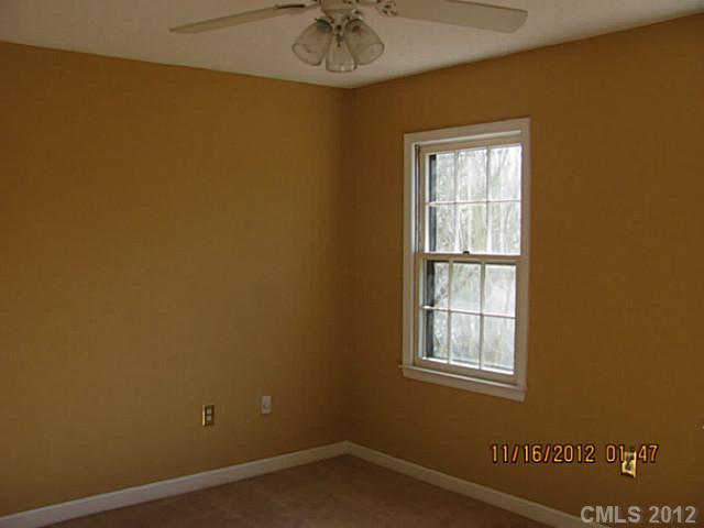 4400 Truscott Road Charlotte, NC 28226 - Photo 12 of 15 an empty room with a window