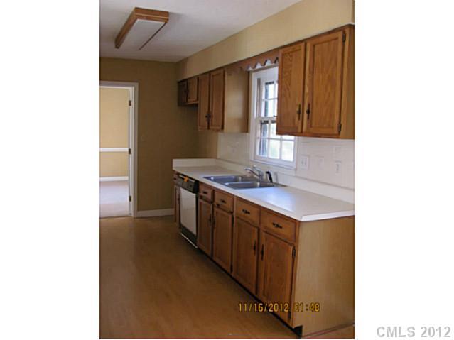 4400 Truscott Road Charlotte, NC 28226 - Photo 7 of 15 a bathroom with a sink and a mirror