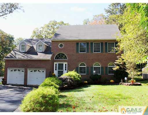 56 Pennington Road New Brunswick, NJ 08901 - Photo 1 of 20 a front view of a house with a yard and garage