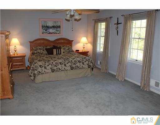 56 Pennington Road New Brunswick, NJ 08901 - Photo 12 of 20 a bedroom with a bed and a window