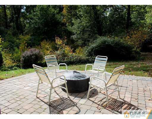 56 Pennington Road New Brunswick, NJ 08901 - Photo 20 of 20 a view of a lounge chair and table in the patio